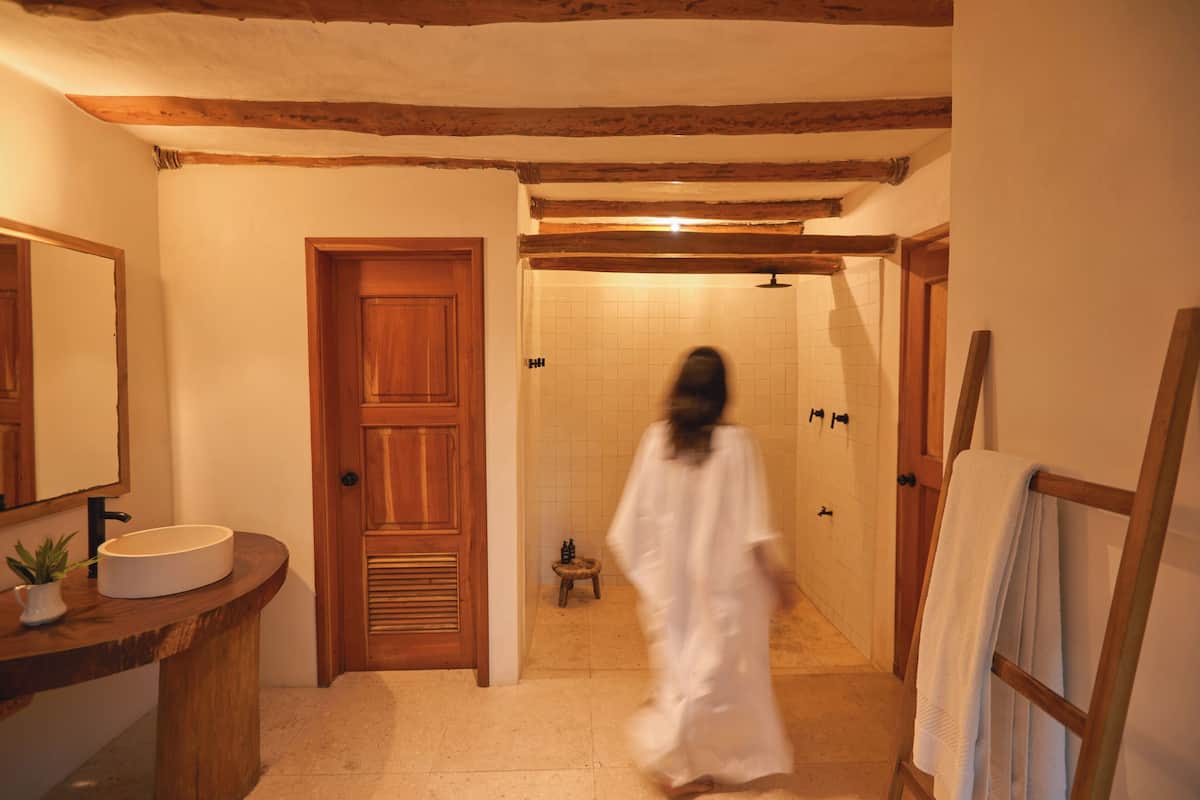 master luxury suite | bathroom | shower, rainfall showerhead, designer toiletries, hair dryer