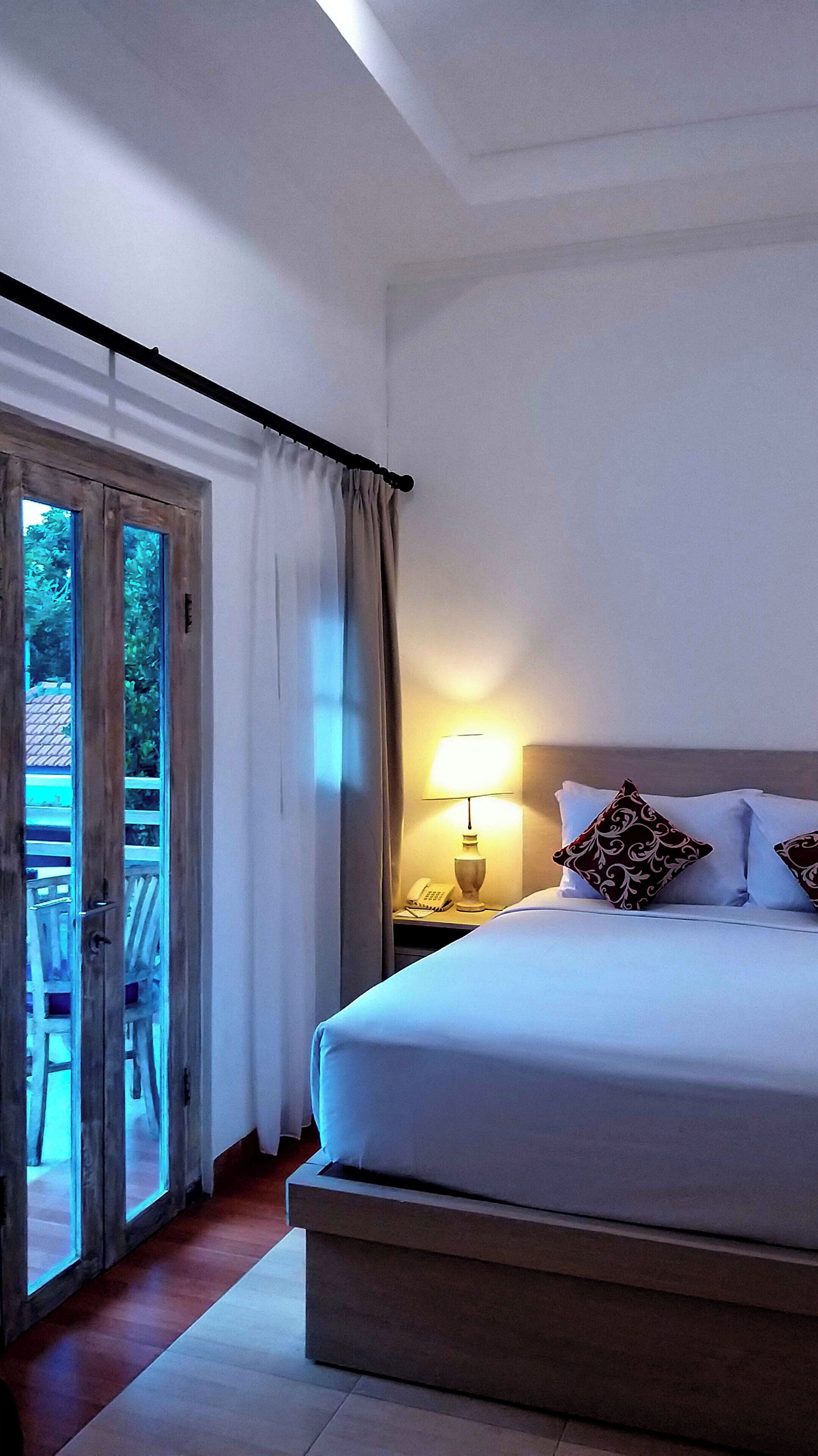 deluxe double room, pool view | in-room safe, desk, free cots/infant beds, free wifi