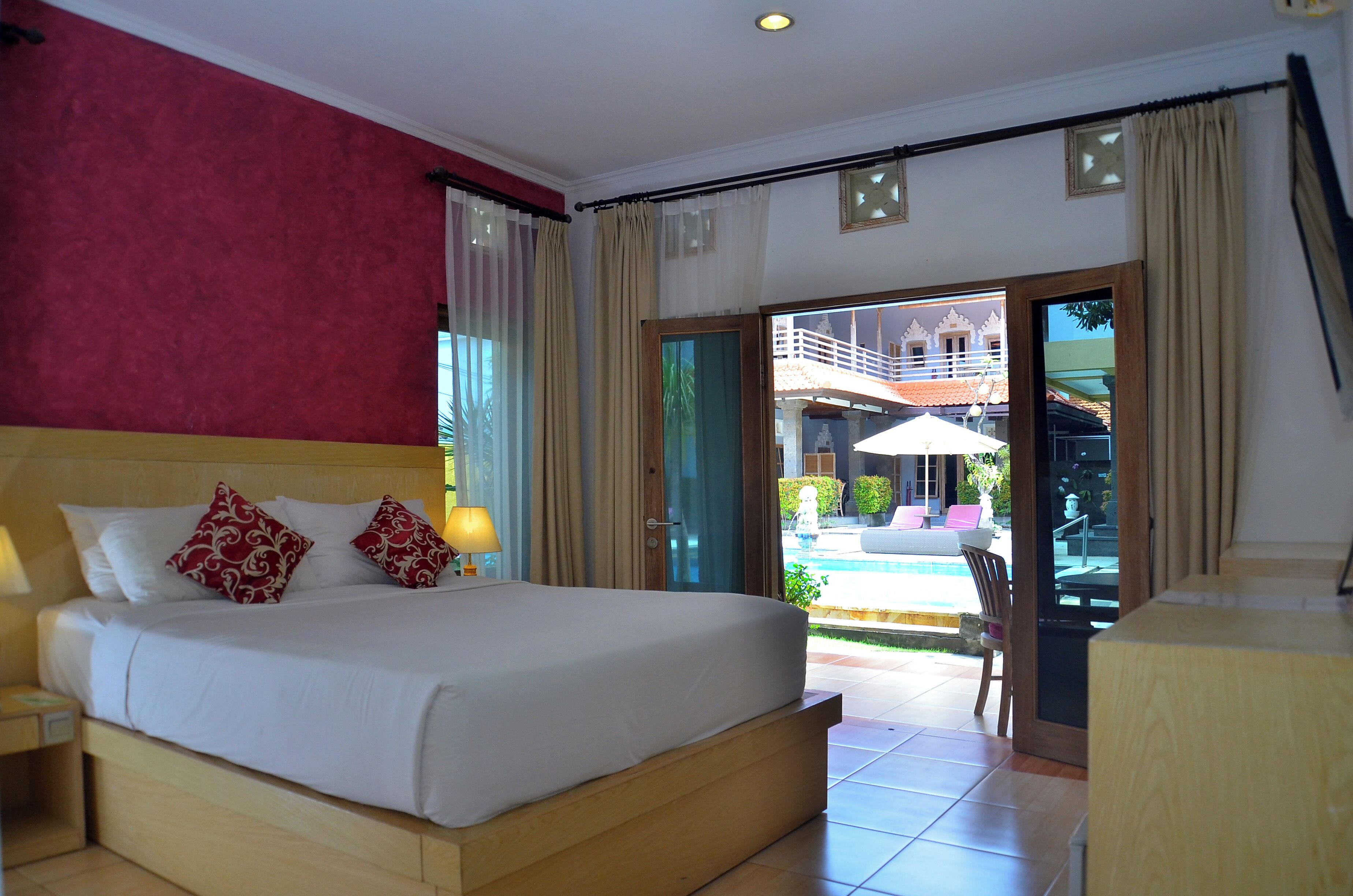 deluxe double room, pool view | in-room safe, desk, free cots/infant beds, free wifi