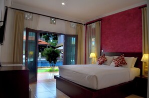 Deluxe Double Room, Pool View | In-room safe, desk, blackout drapes, free cribs/infant beds - Puri Sading Hotel (Denpasar)