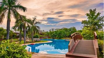 2 outdoor pools, open 7:00 AM to 8:00 PM, pool umbrellas, pool loungers