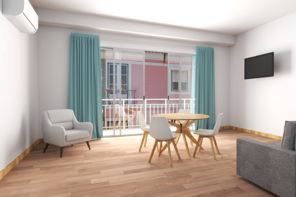 A modern living room with a grey sofa, a round wooden table with chairs, a TV mounted on the wall, and a balcony with teal curtains.