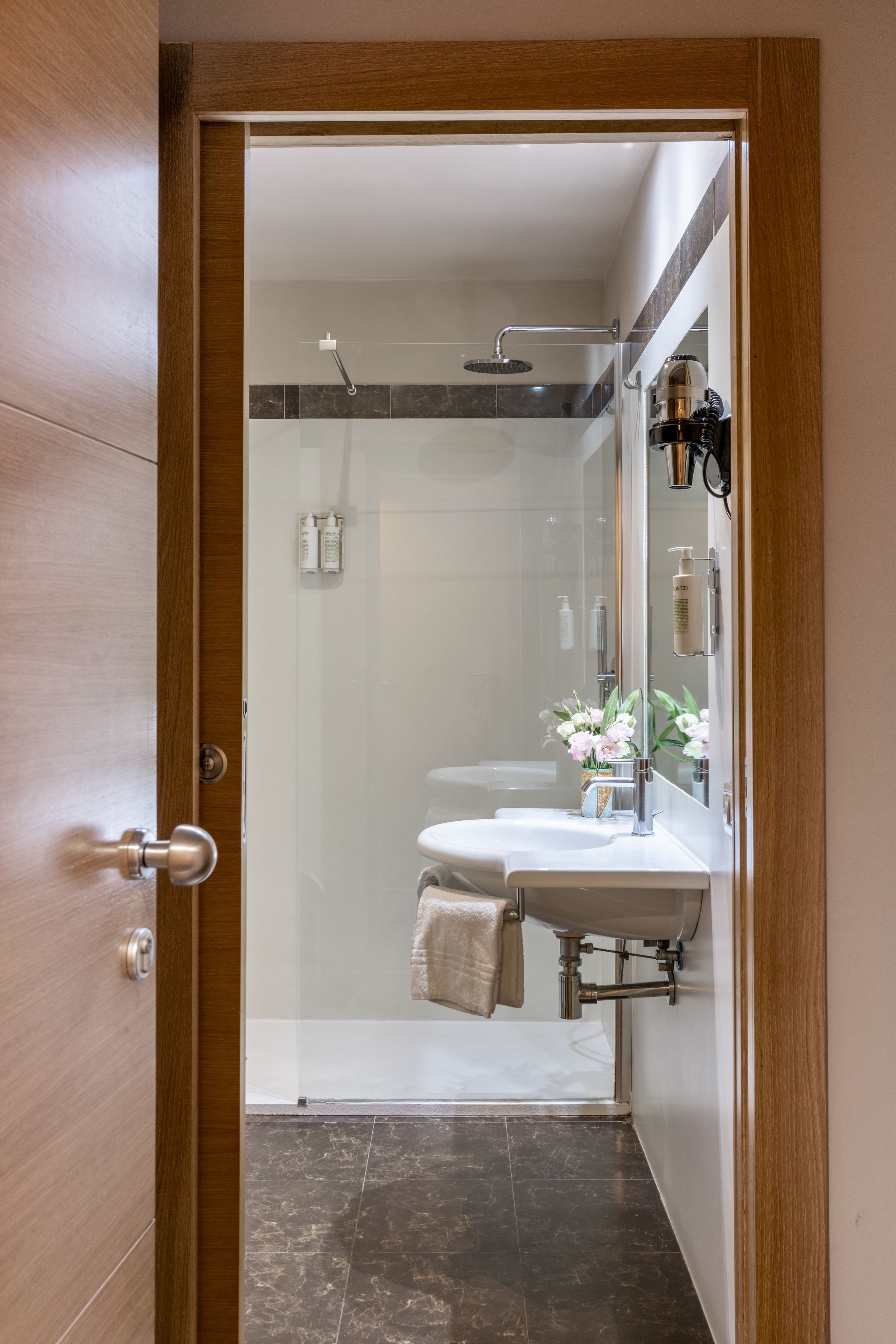 eco-friendly toiletries, hair dryer, slippers, bidet