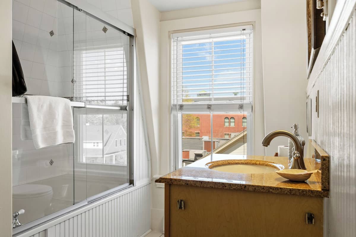 superior bedroom | bathroom | designer toiletries, hair dryer, bathrobes, towels