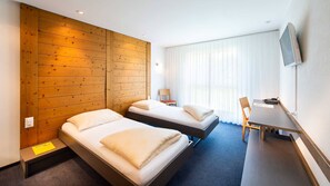 Ropa de cama de alta calidad, escritorio, insonorización y wifi gratis 