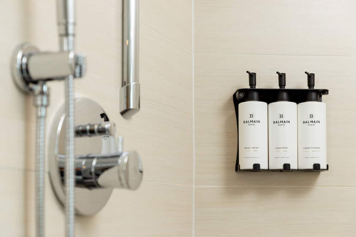 Shower, designer toiletries, hair dryer, bathrobes