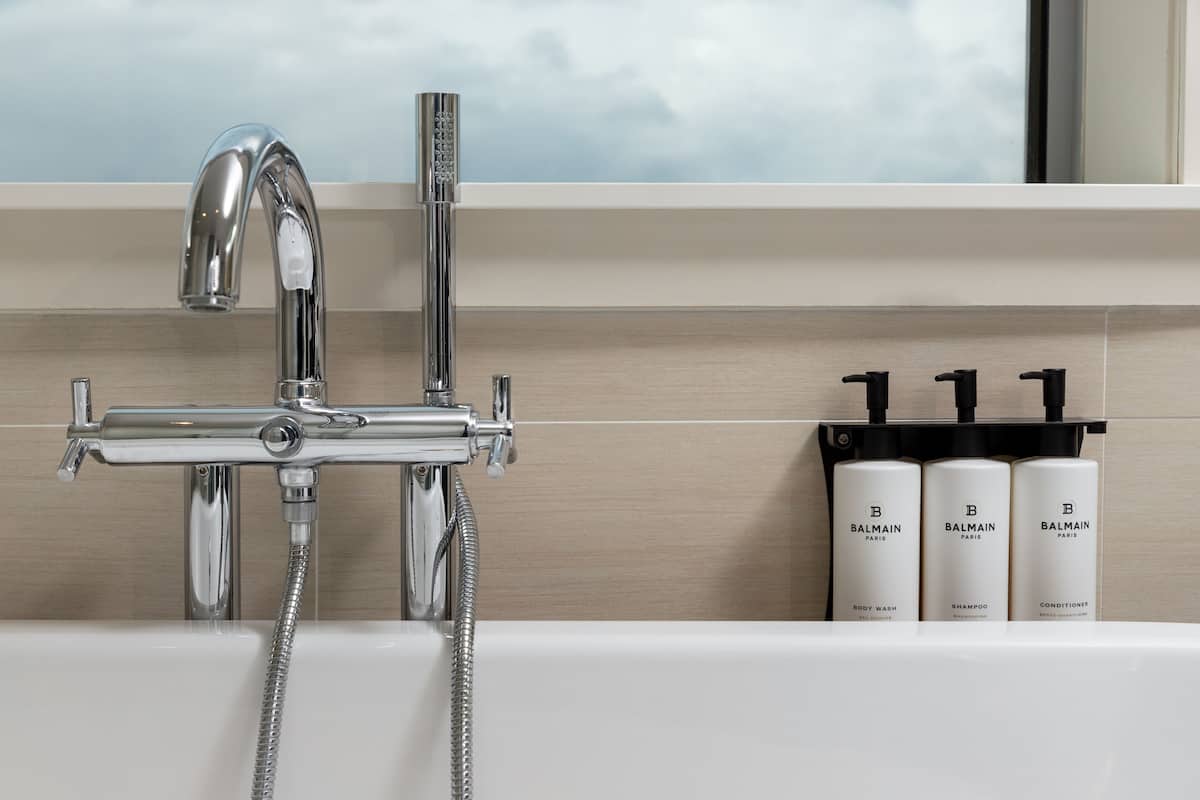 Shower, designer toiletries, hair dryer, bathrobes
