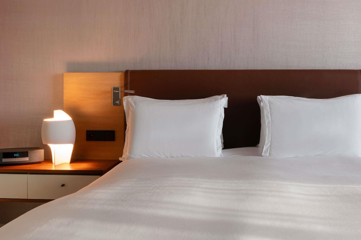 Premium bedding, memory foam beds, free minibar items, in-room safe