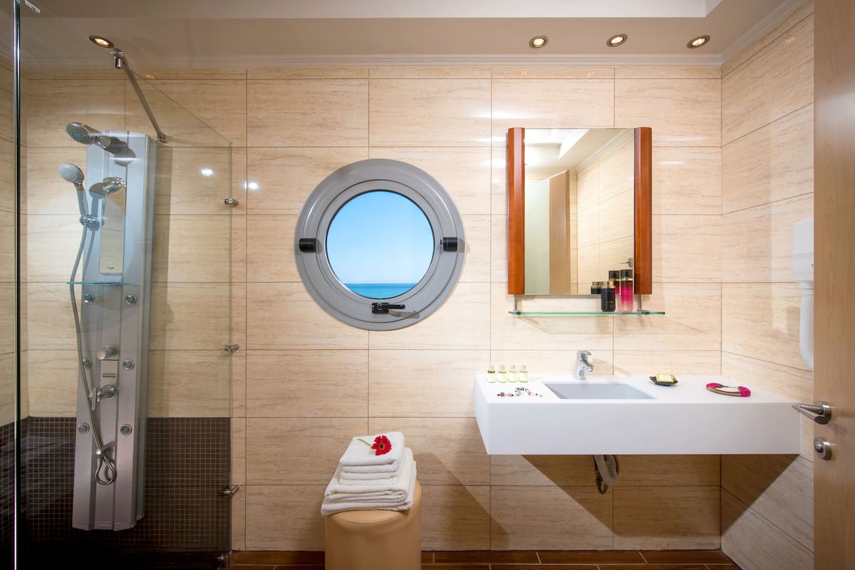 junior suite | bathroom | shower, rainfall showerhead, designer toiletries, hair dryer
