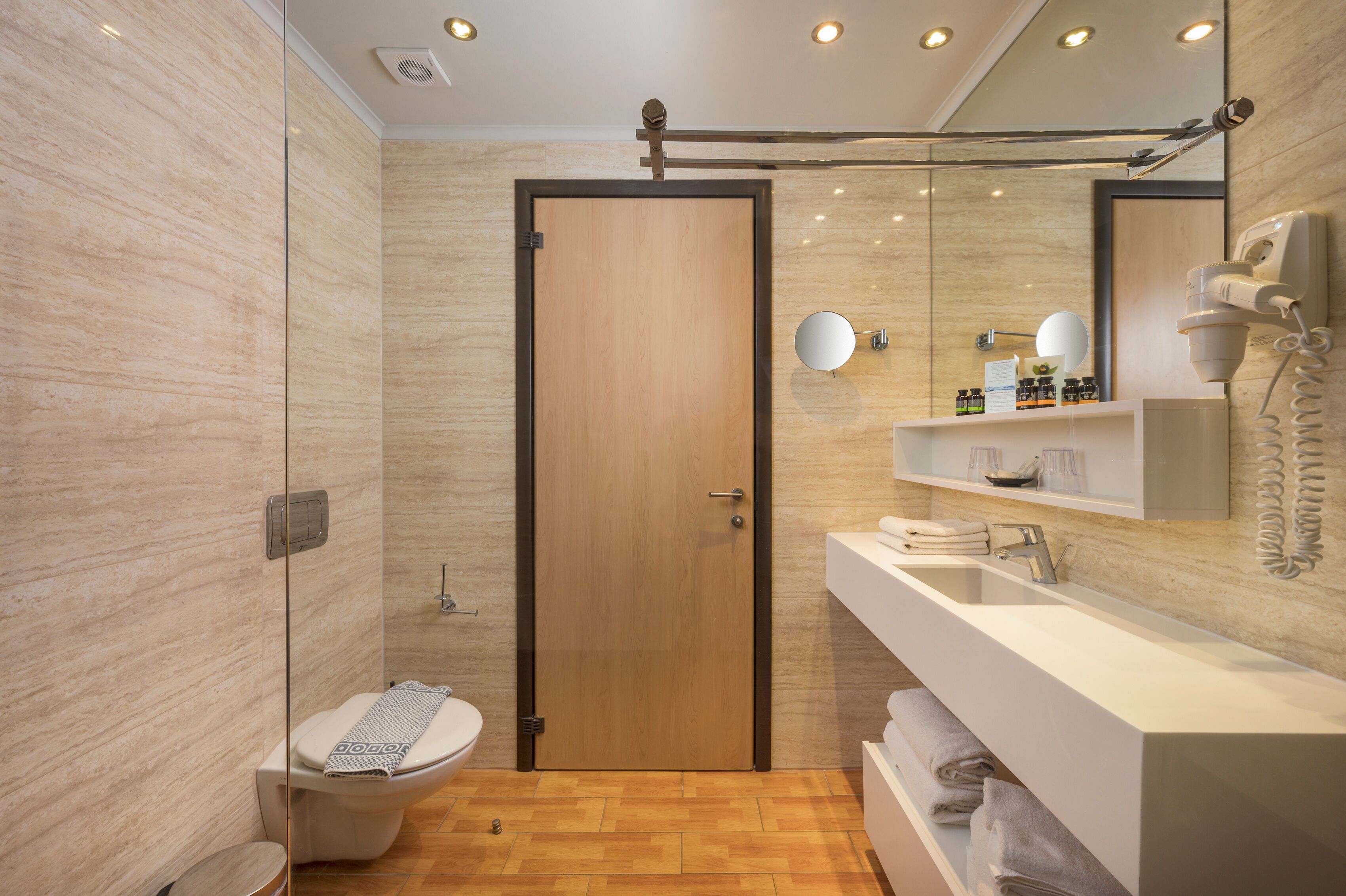junior suite | bathroom | shower, rainfall showerhead, designer toiletries, hair dryer