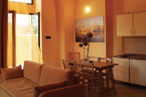 Apartment | Living area | TV - Il Tabacchificio Hotel (Gagliano del Capo)