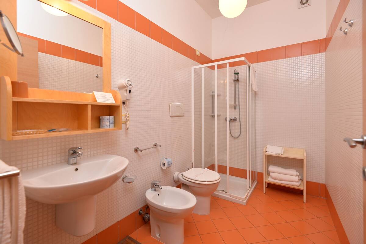 superior triple room | bathroom | free toiletries, hair dryer, bidet, towels