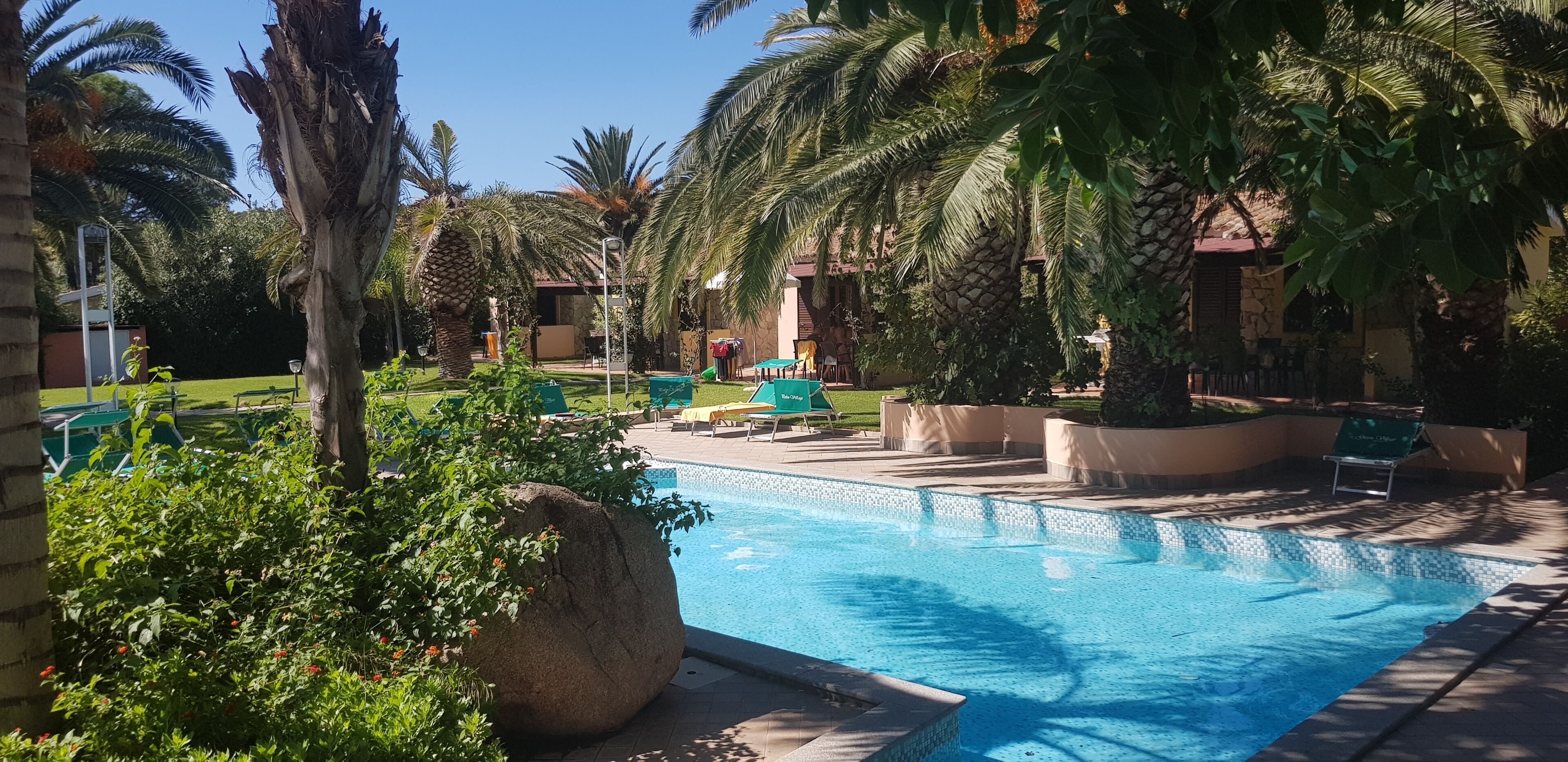 seasonal outdoor pool, pool umbrellas, pool loungers