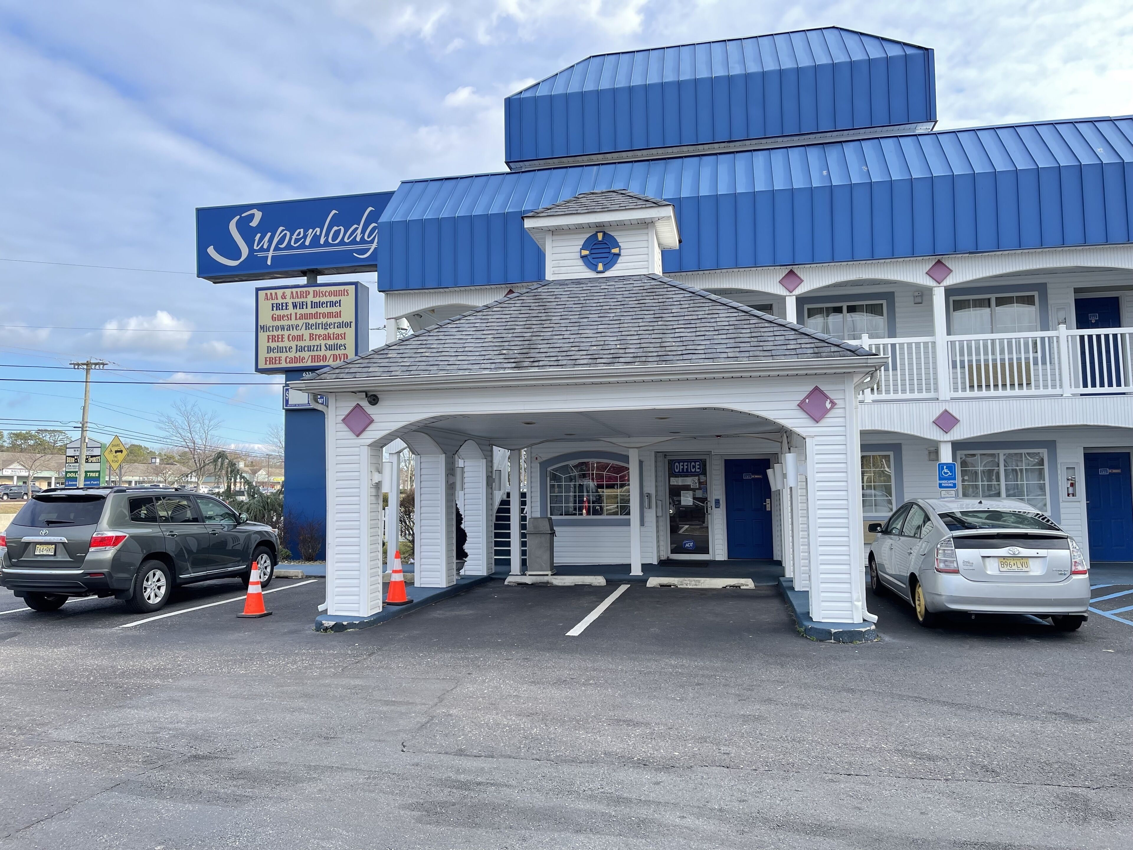 A SuperLodge building with a blue roof and white exterior.
