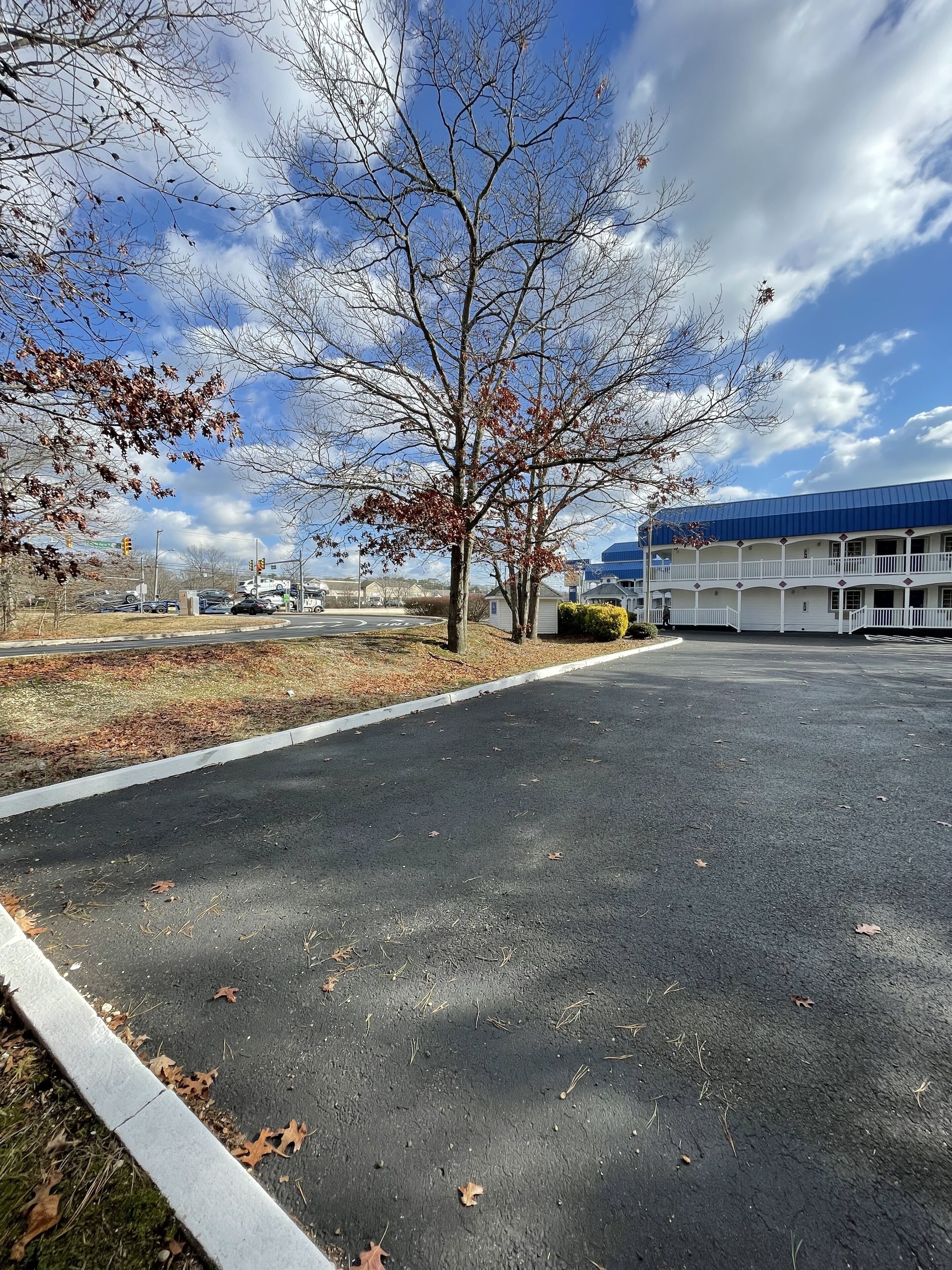 A parking lot with a building in the background.