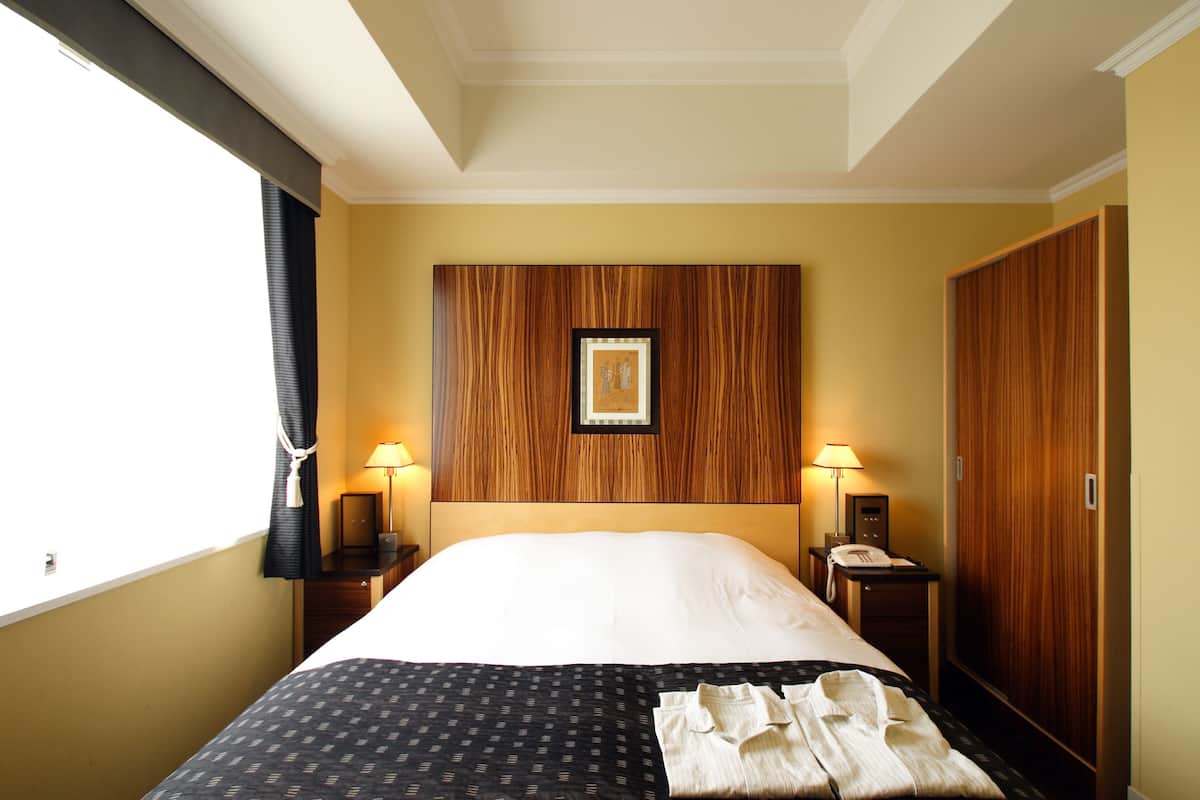 Premium bedding, down duvets, in-room safe, desk