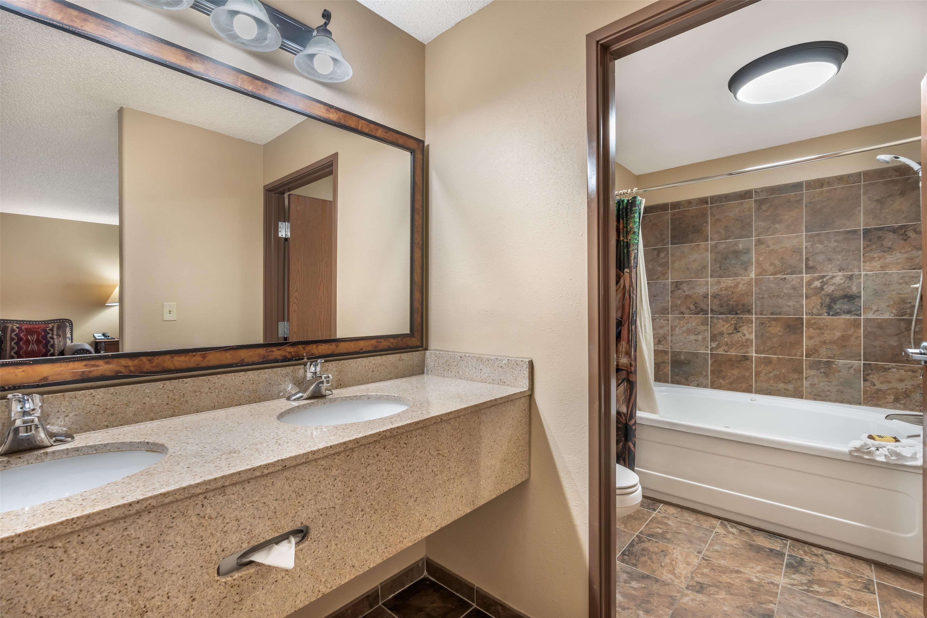 suite, 1 king bed with sofa bed, non smoking, jetted tub (with sofabed) | bathroom | combined shower/bathtub, free toiletries, hair dryer, towels