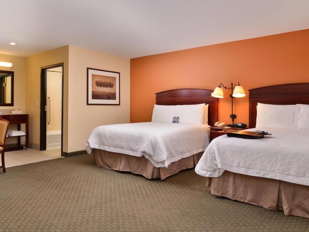 Hypo-allergenic bedding, pillowtop beds, desk, laptop workspace
