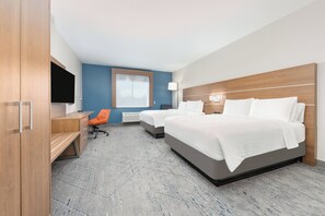 Ropa de cama hipoalergénica y caja de seguridad en la habitación 