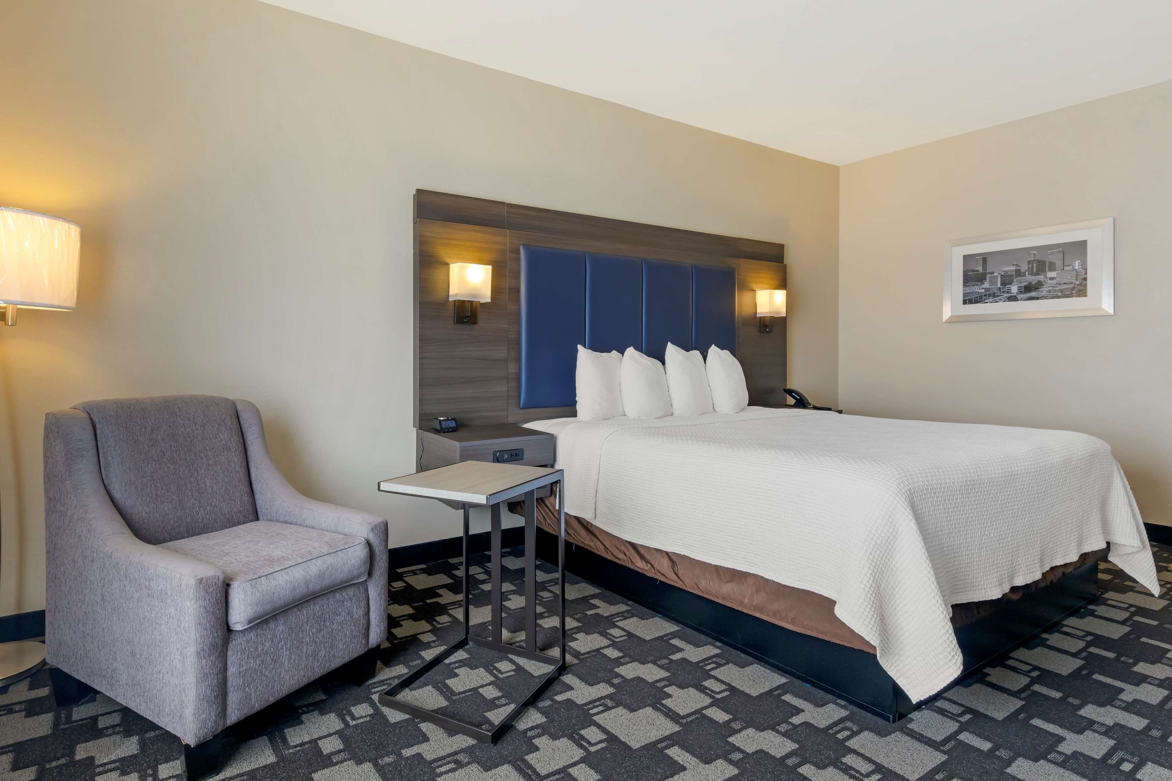 desk, laptop workspace, blackout curtains, iron/ironing board