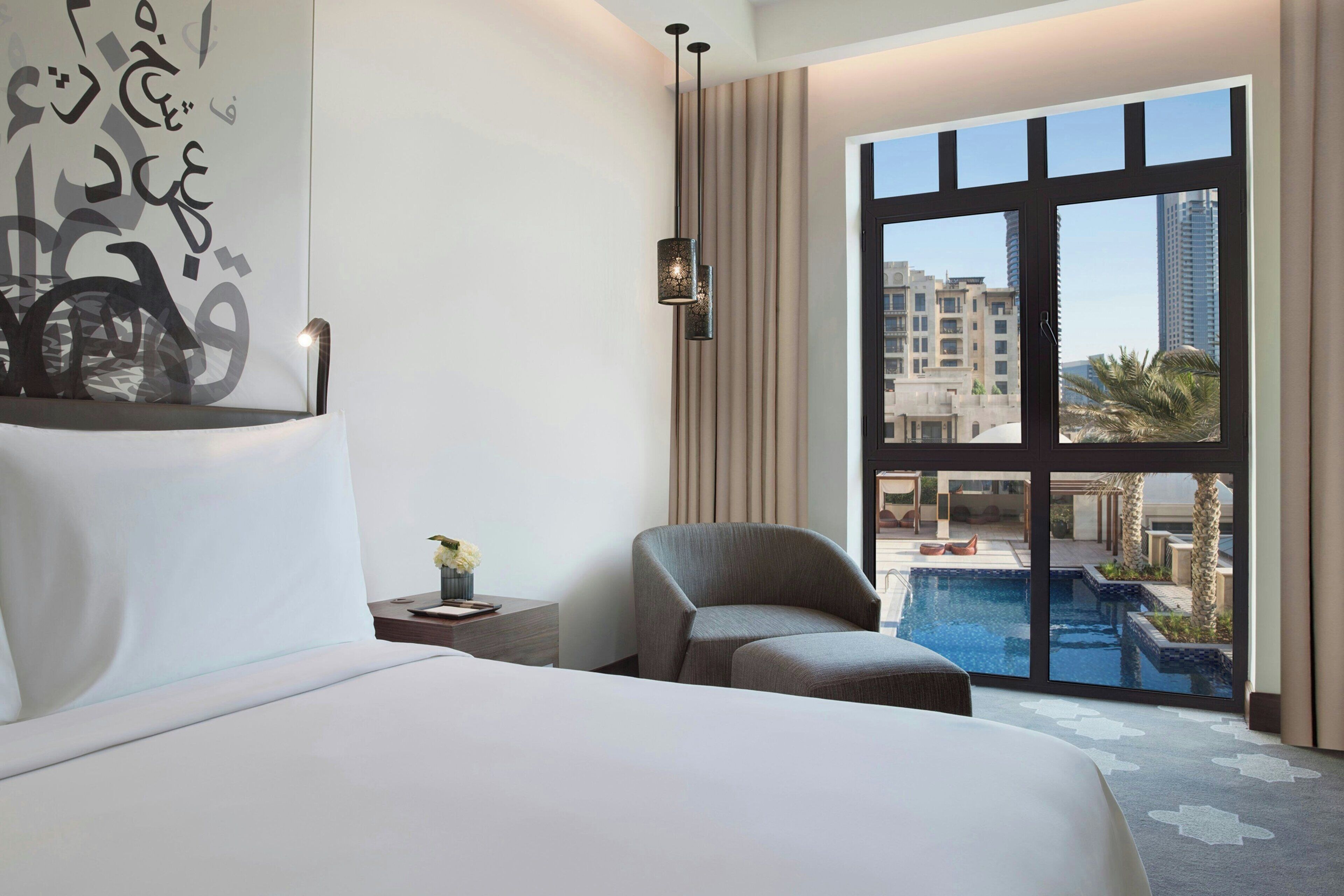 deluxe room, 1 king bed, pool view, poolside | 1 bedroom, premium bedding, in-room safe, desk