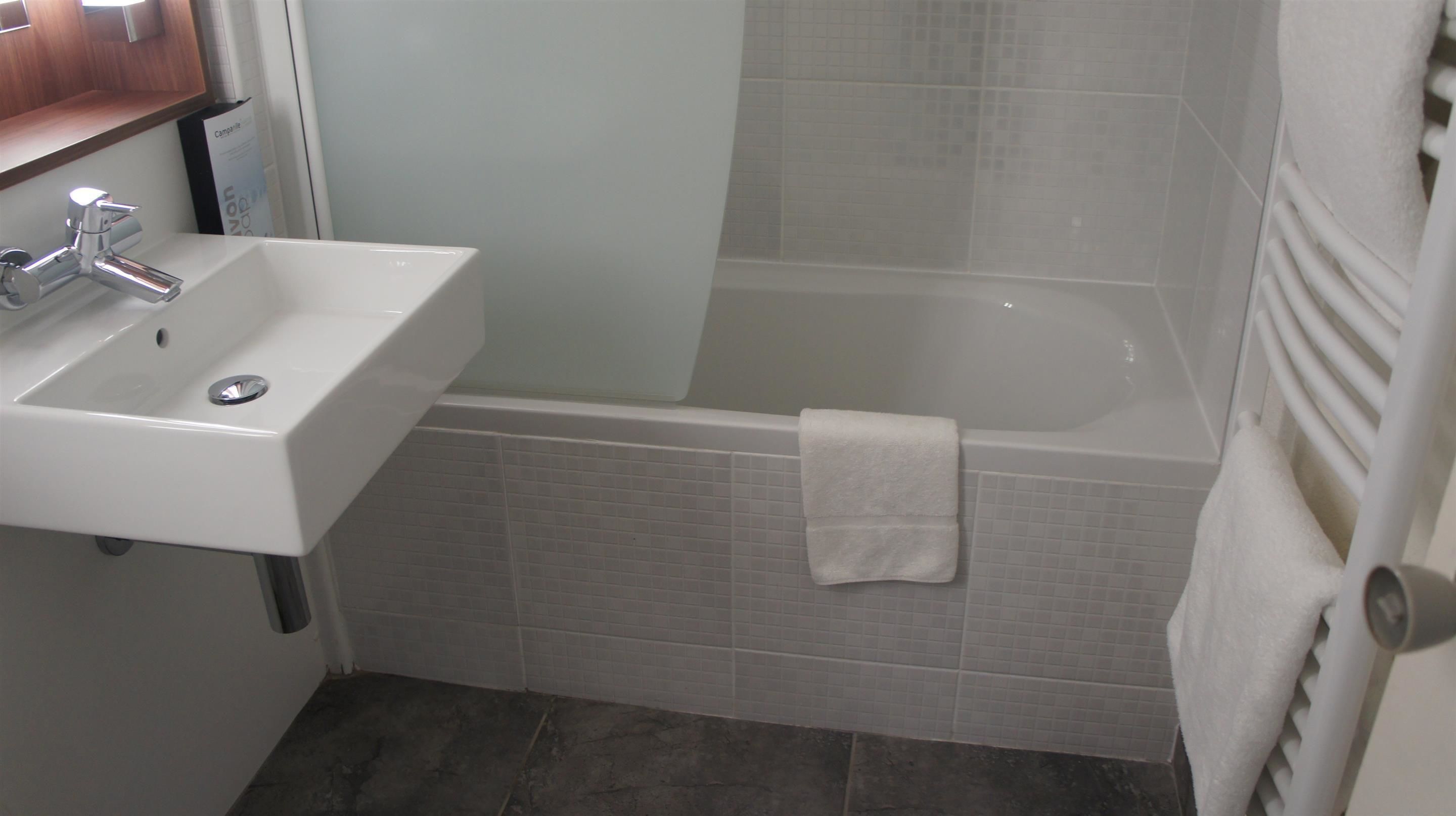 rainfall showerhead, eco-friendly toiletries, hair dryer, towels