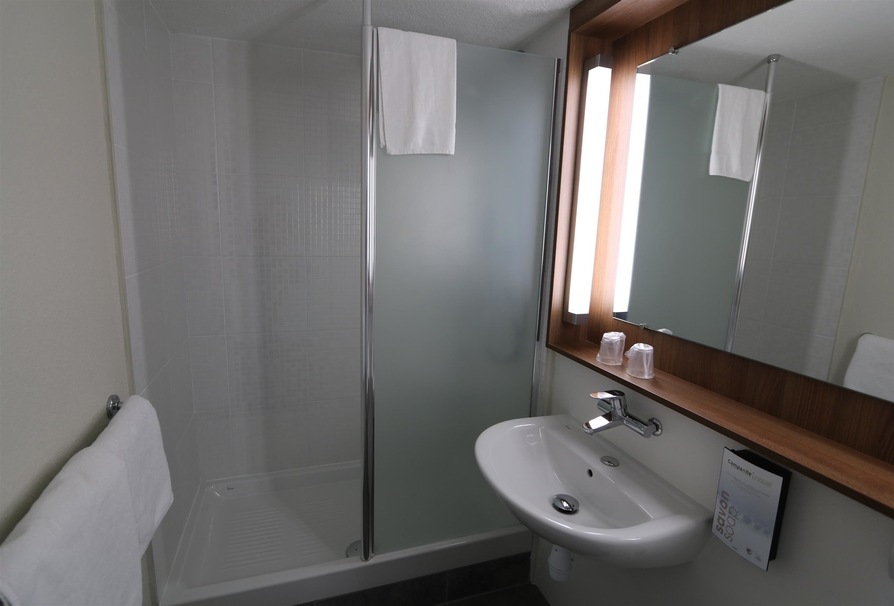 rainfall showerhead, eco-friendly toiletries, hair dryer, towels