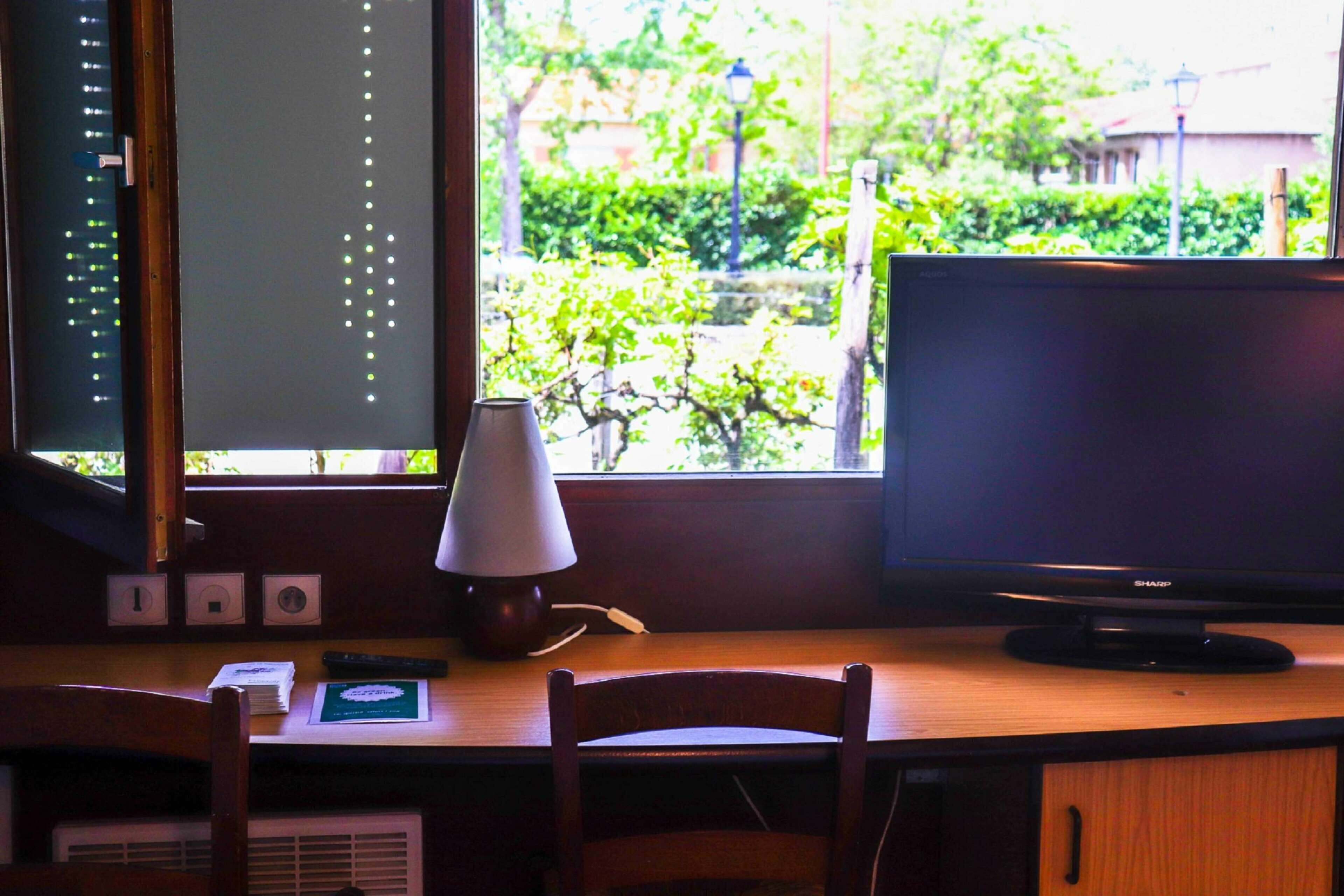 desk, laptop workspace, blackout curtains, iron/ironing board