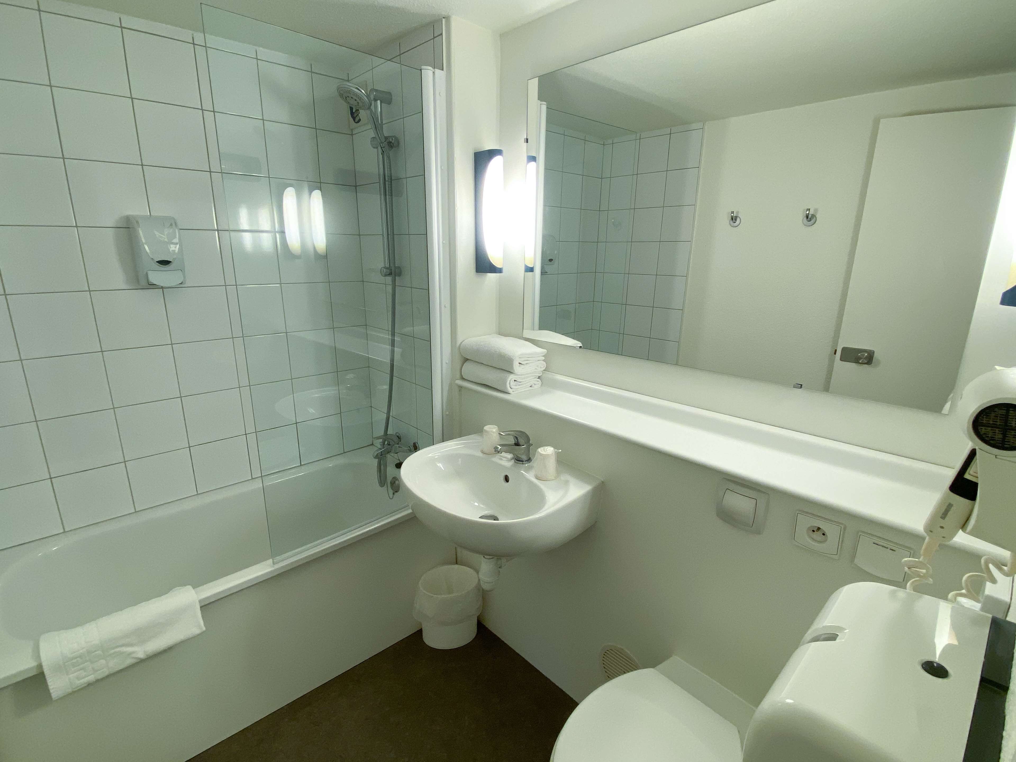 eco-friendly toiletries, hair dryer, towels