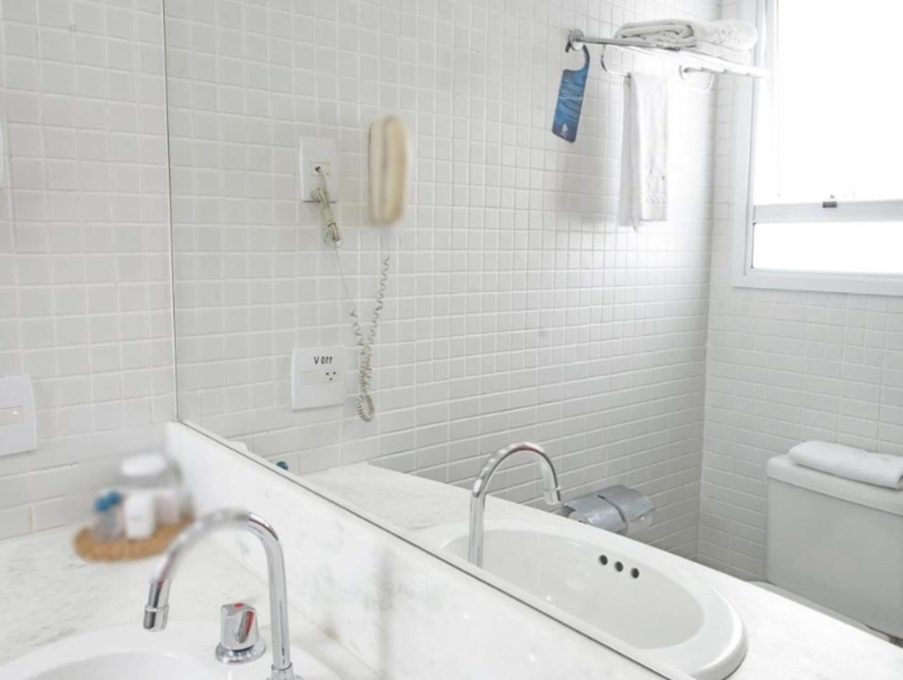 shower, designer toiletries, hair dryer, towels