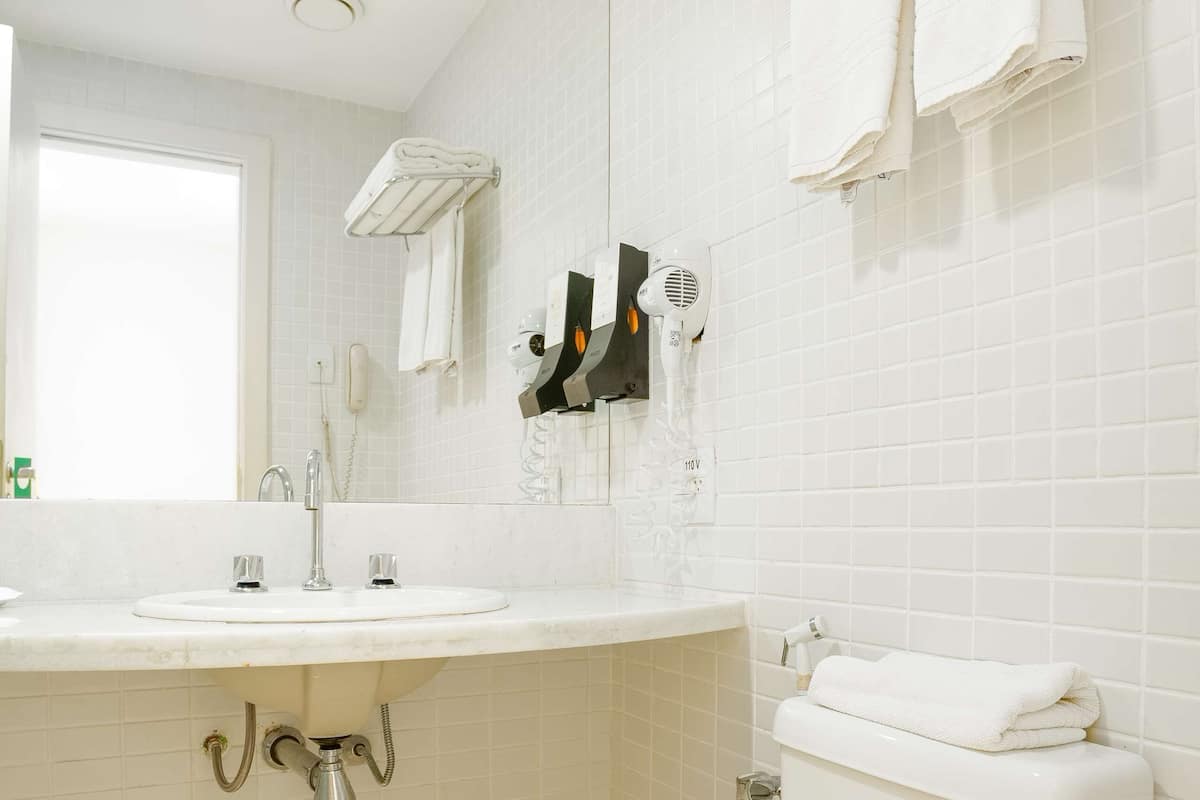 shower, designer toiletries, hair dryer, towels