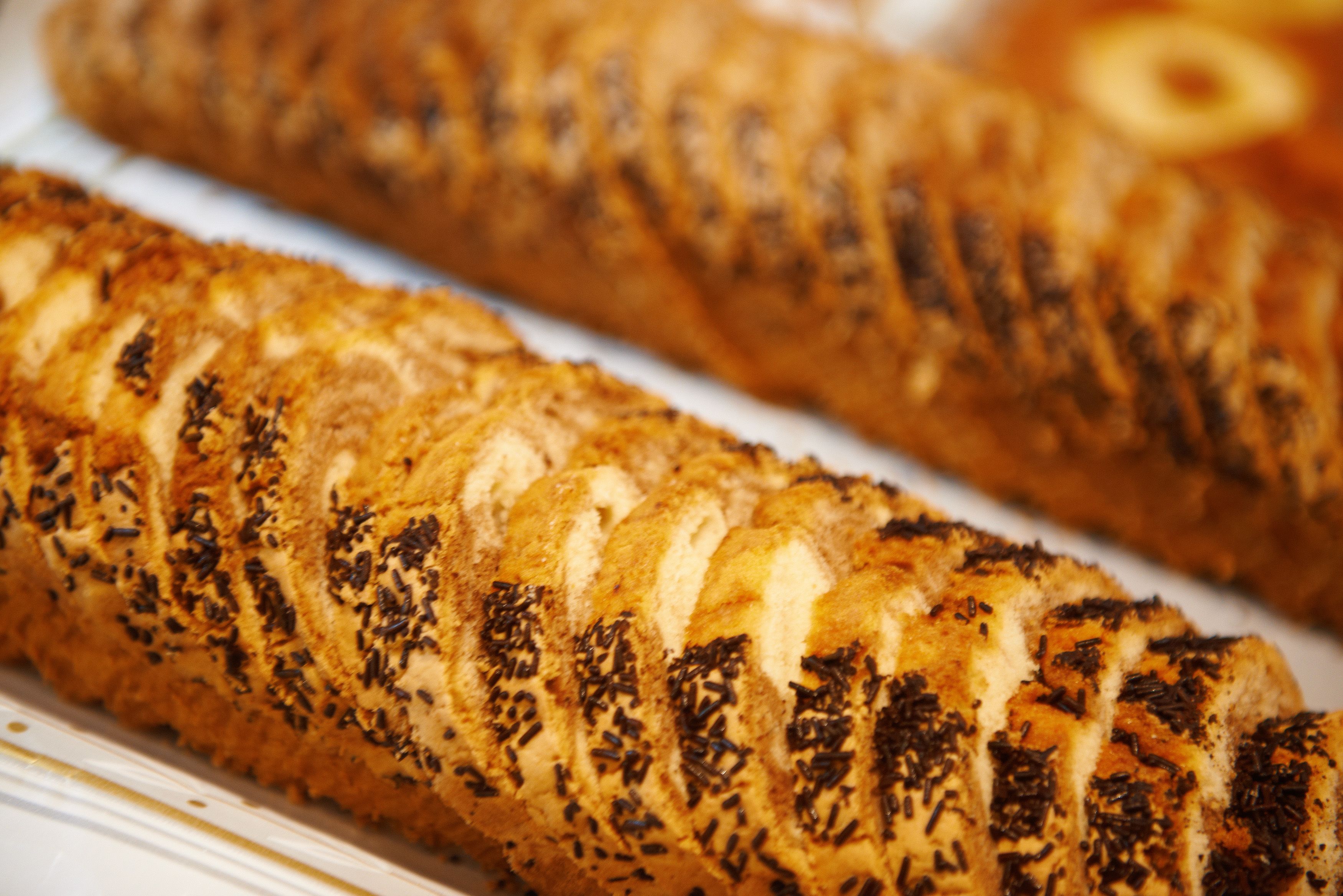 A loaf of bread with a patterned crust, likely a type of artisan bread.