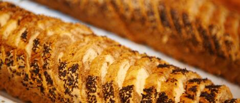 A loaf of bread with a patterned crust, likely a type of artisan bread.