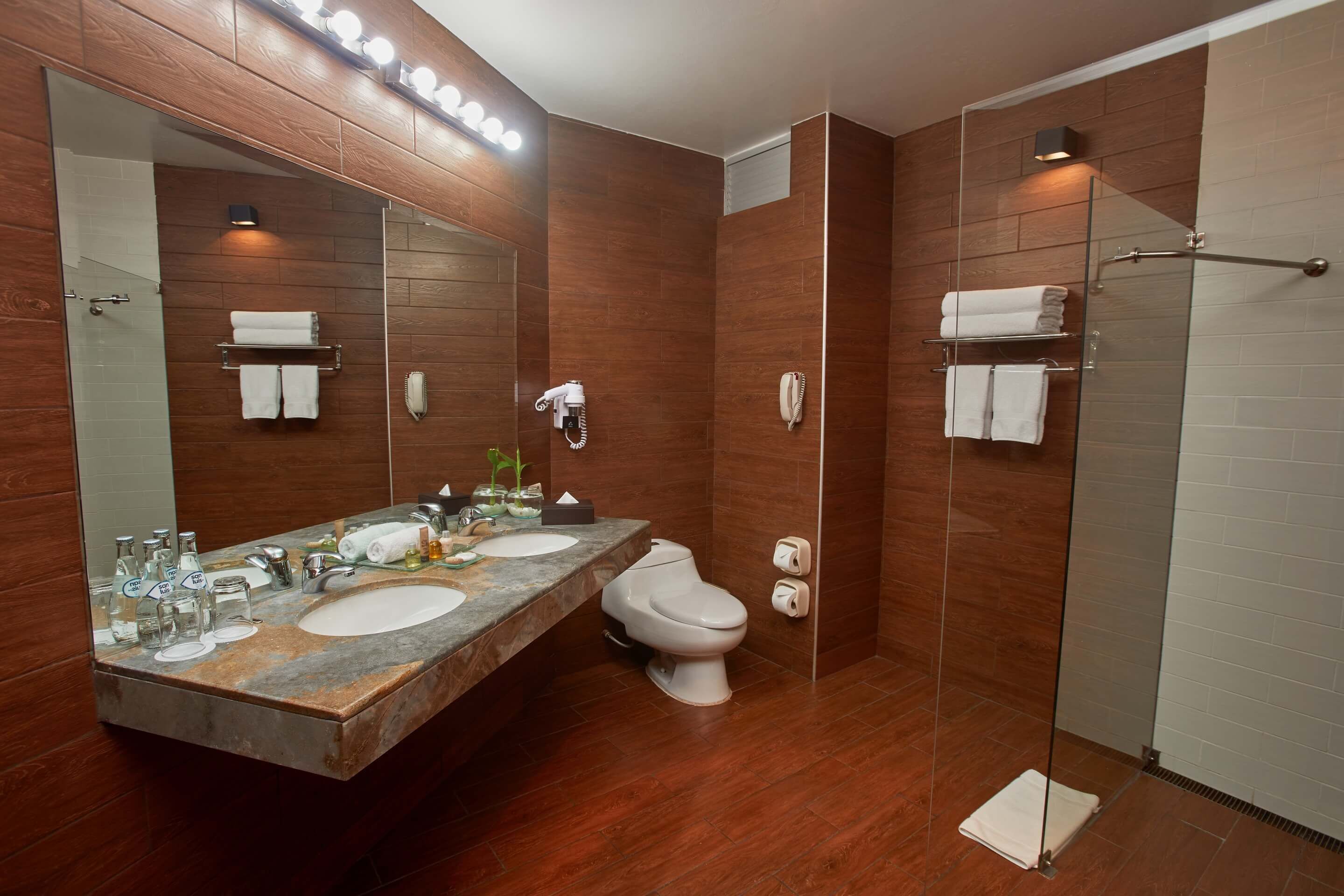 suite, 1 king bed, lake view | bathroom | combined shower/bathtub, rainfall showerhead, free toiletries