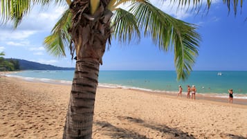 On the beach, sun-loungers, beach umbrellas, beach towels