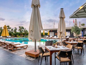 Outdoor pool, pool umbrellas, pool loungers