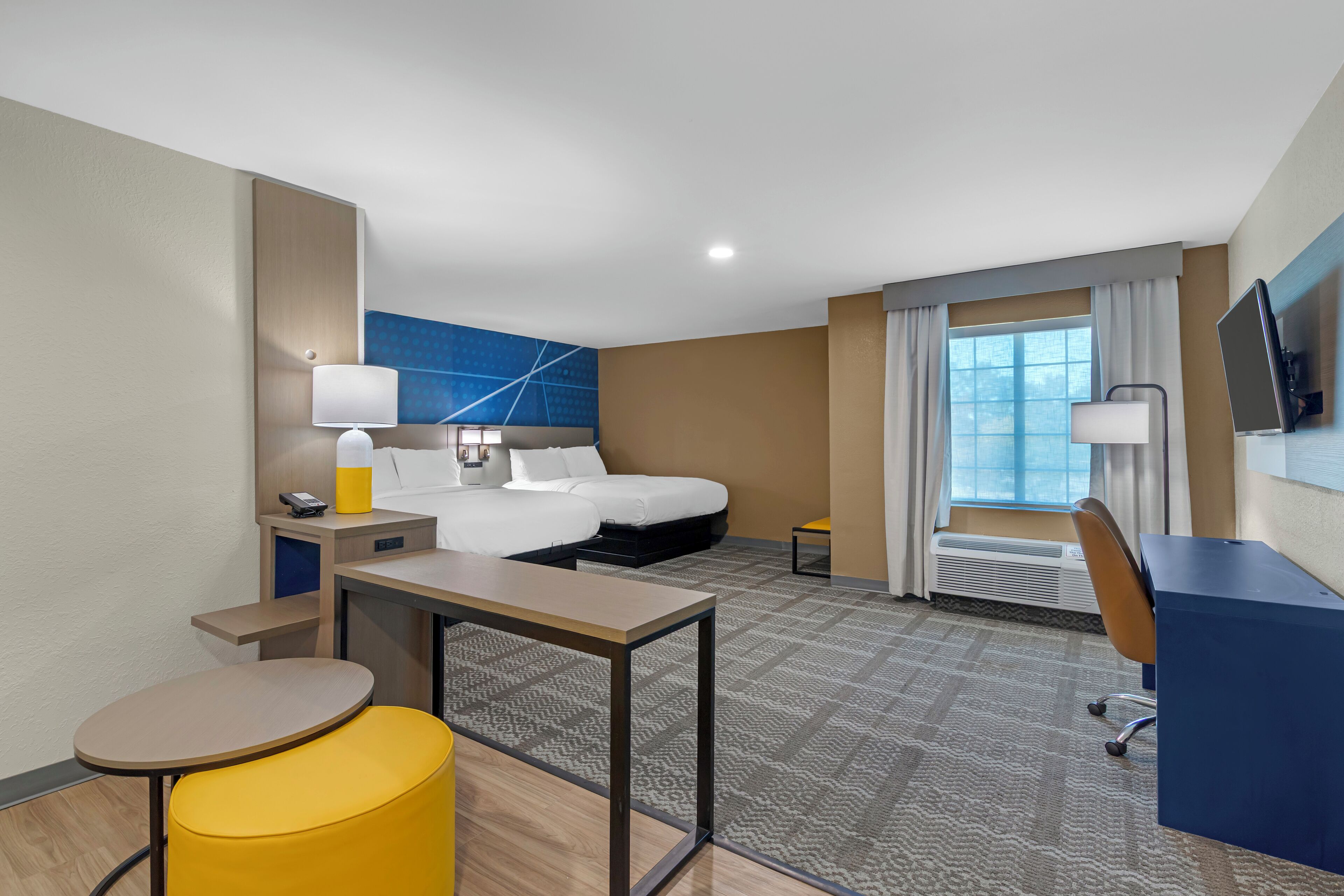 Desk, laptop workspace, iron/ironing board, free cribs/infant beds