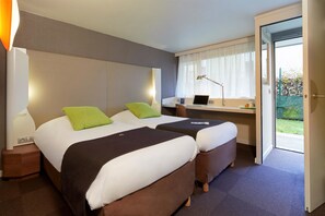 Premium bedding, desk, laptop workspace, blackout curtains