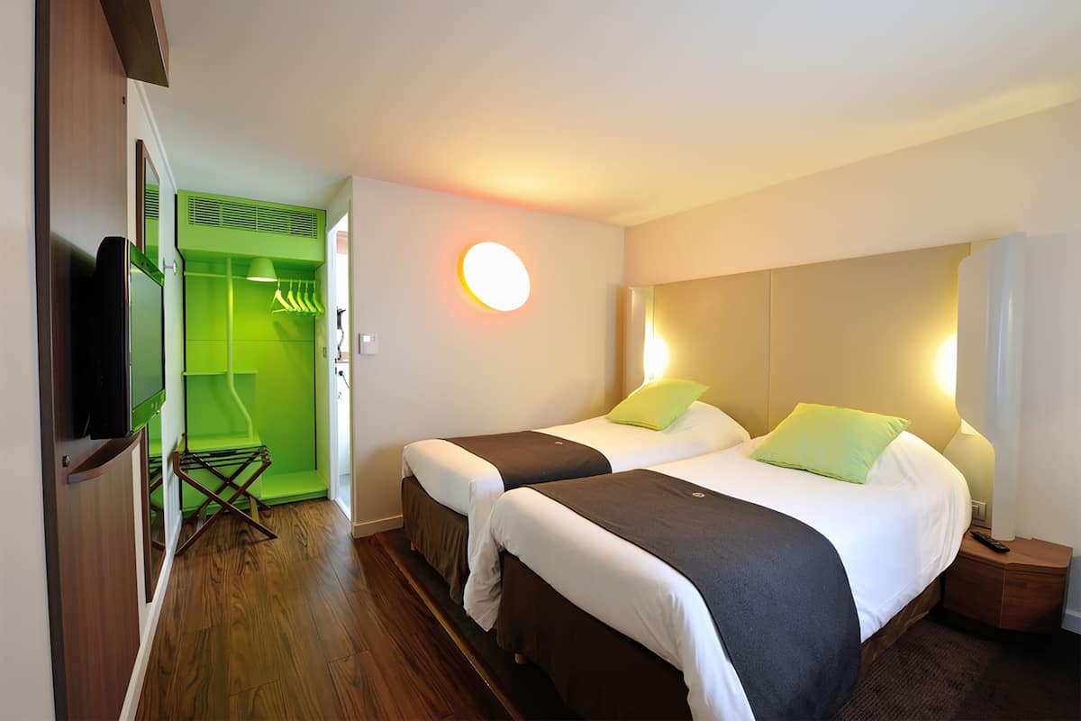 Premium bedding, desk, laptop workspace, blackout drapes