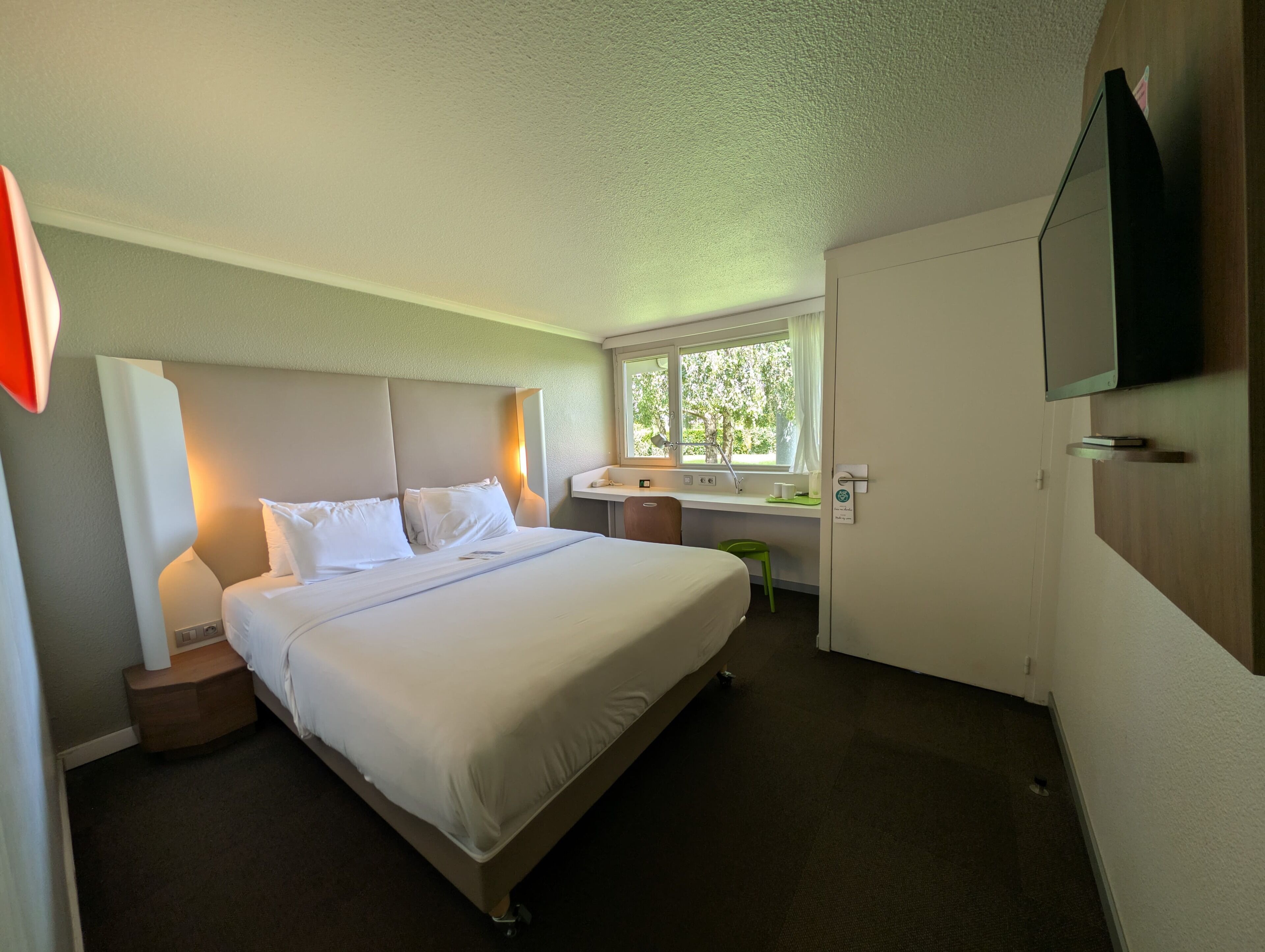 Premium bedding, desk, laptop workspace, blackout curtains
