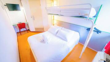 Cozy retreat with a bunk bed, desk, and flat-screen TV.