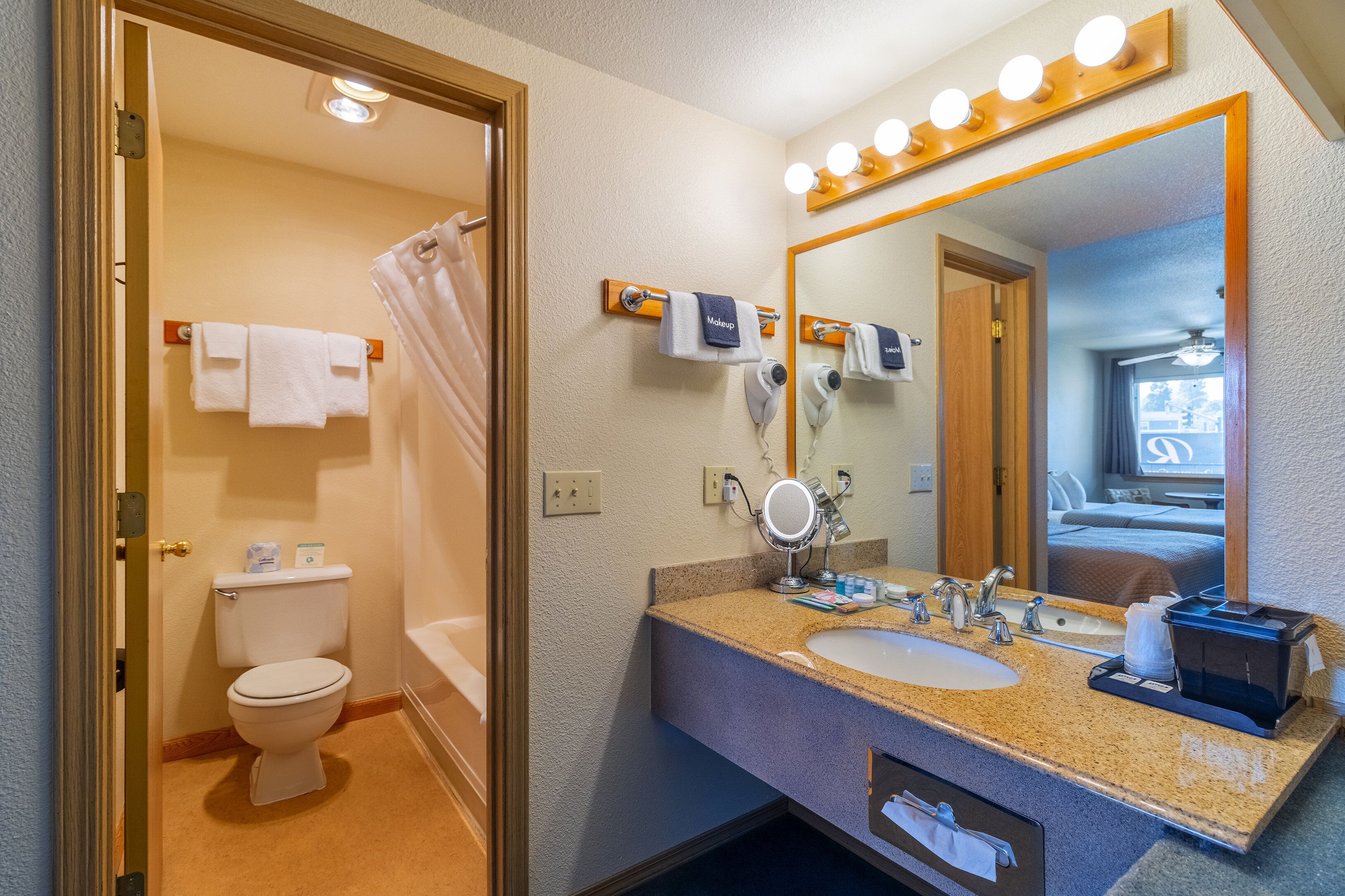 two queen beds | bathroom | combined shower/bathtub, free toiletries, hair dryer, towels