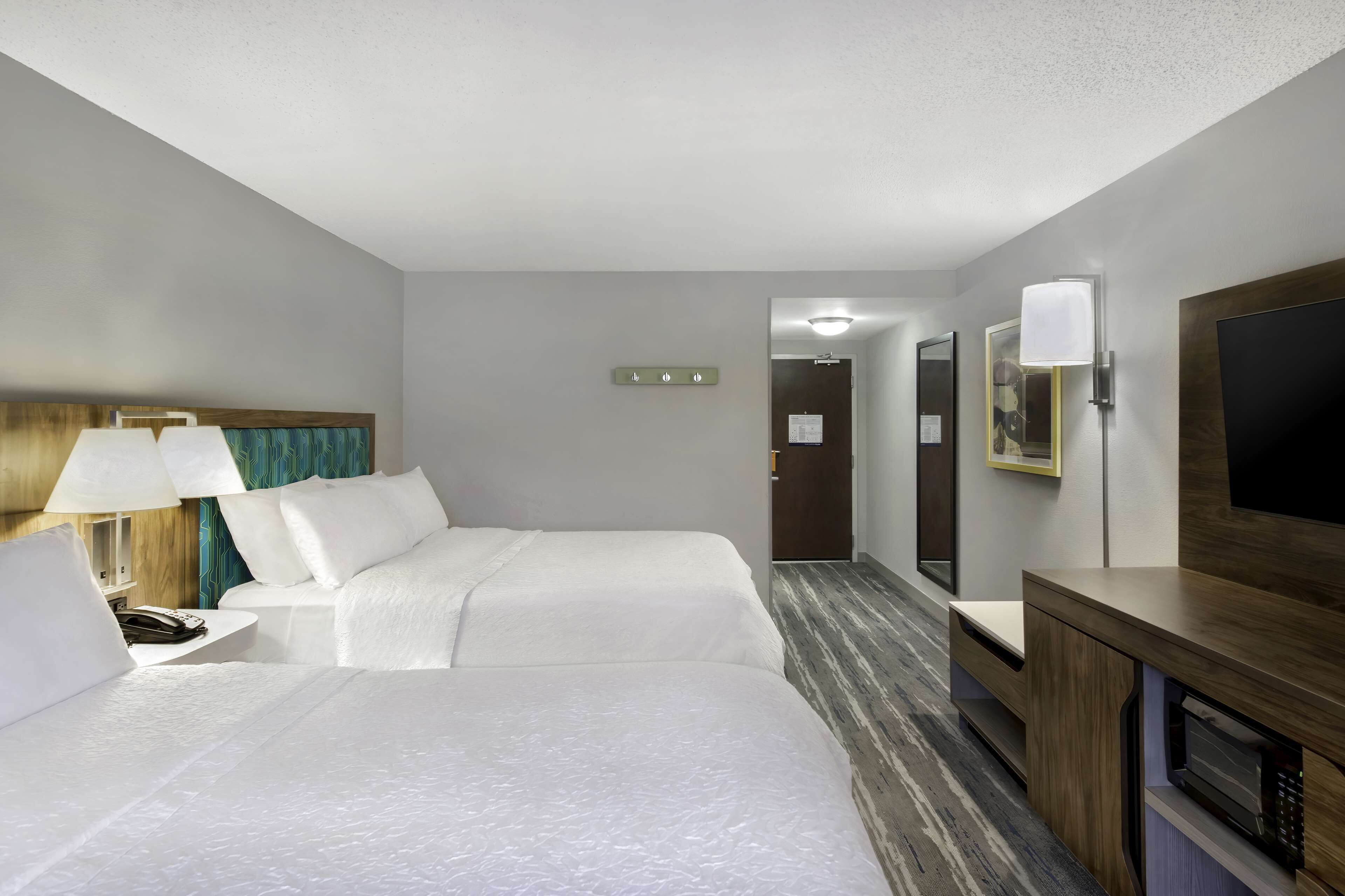 premium bedding, desk, blackout curtains, iron/ironing board