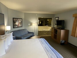 Suíte superior, 1 cama King, para não fumantes | Escrivaninha, cortinas blackout, quartos à prova de som