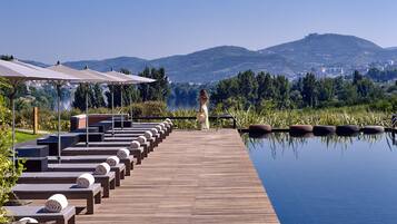 Indoor pool, seasonal outdoor pool, pool umbrellas, sun loungers