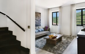 Quinta Duplex Suite | Living area | 48-inch LCD TV with satellite channels, TV, fireplace