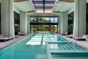 Indoor pool, seasonal outdoor pool, pool umbrellas, pool loungers