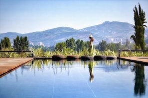 Indoor pool, seasonal outdoor pool, pool umbrellas, pool loungers