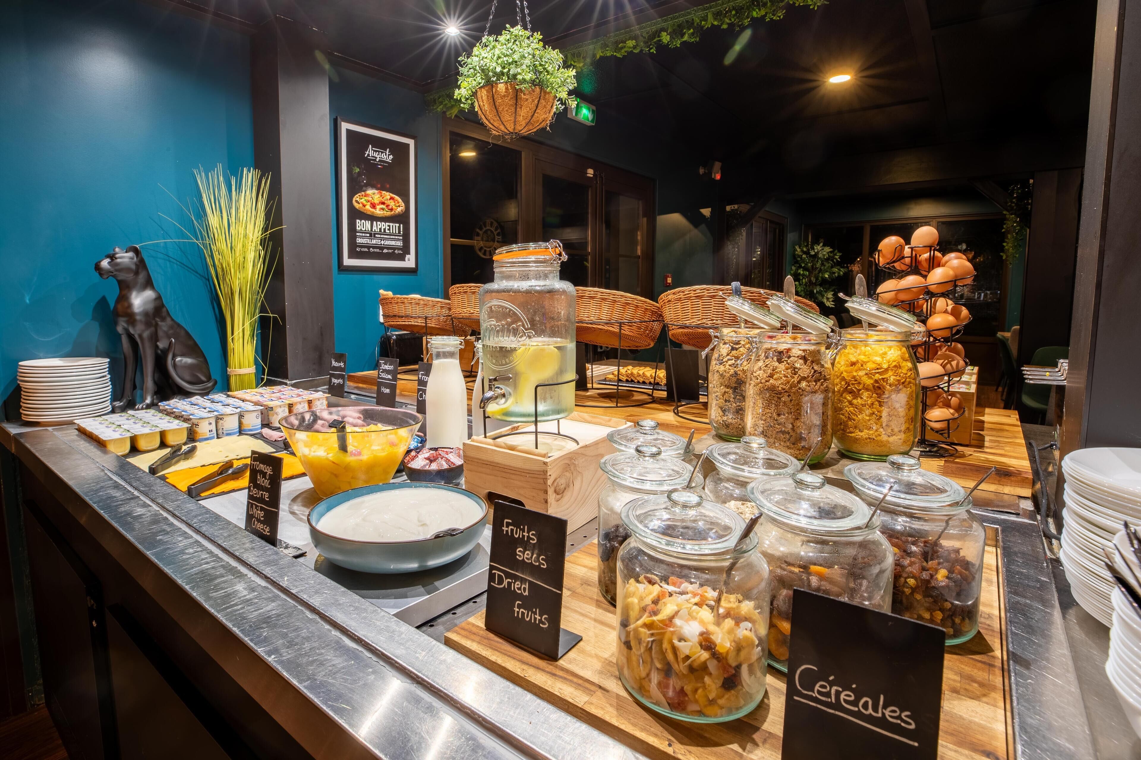 A buffet with various food items and a sign indicating 'fruits, seeds, dried fruits'.