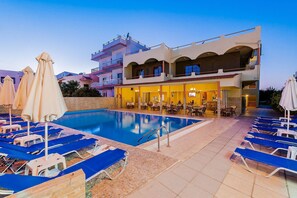 Seasonal outdoor pool, pool umbrellas, pool loungers